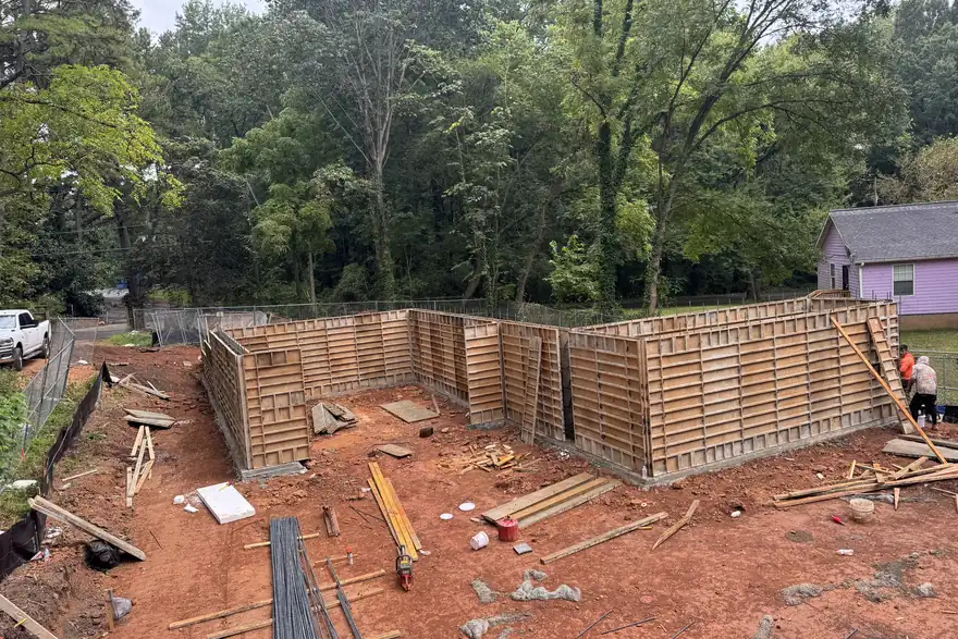 Block foundation forms set on a cleared wooded lot in red Georgia clay